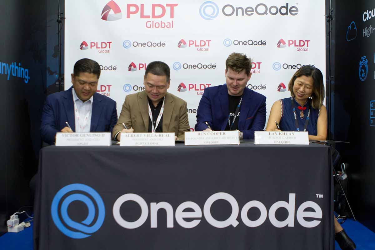 OneQode PLDT MOU signing ceremony at CommunicAsia 2022. From left to right are Victor Genuino II, President and CEO of ePLDT, Albert Villa-Real, President and CEO of PLDT Global, Ben Cooper, Chief Architect at OneQode, and Lay Khuan Soh, Head of Carrier at OneQode